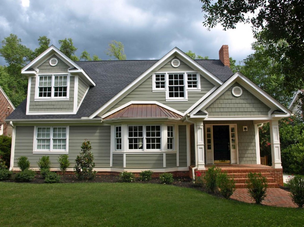 Dramatic conversion of this duplex into a single family home. Only the bay window and front door location are original. 